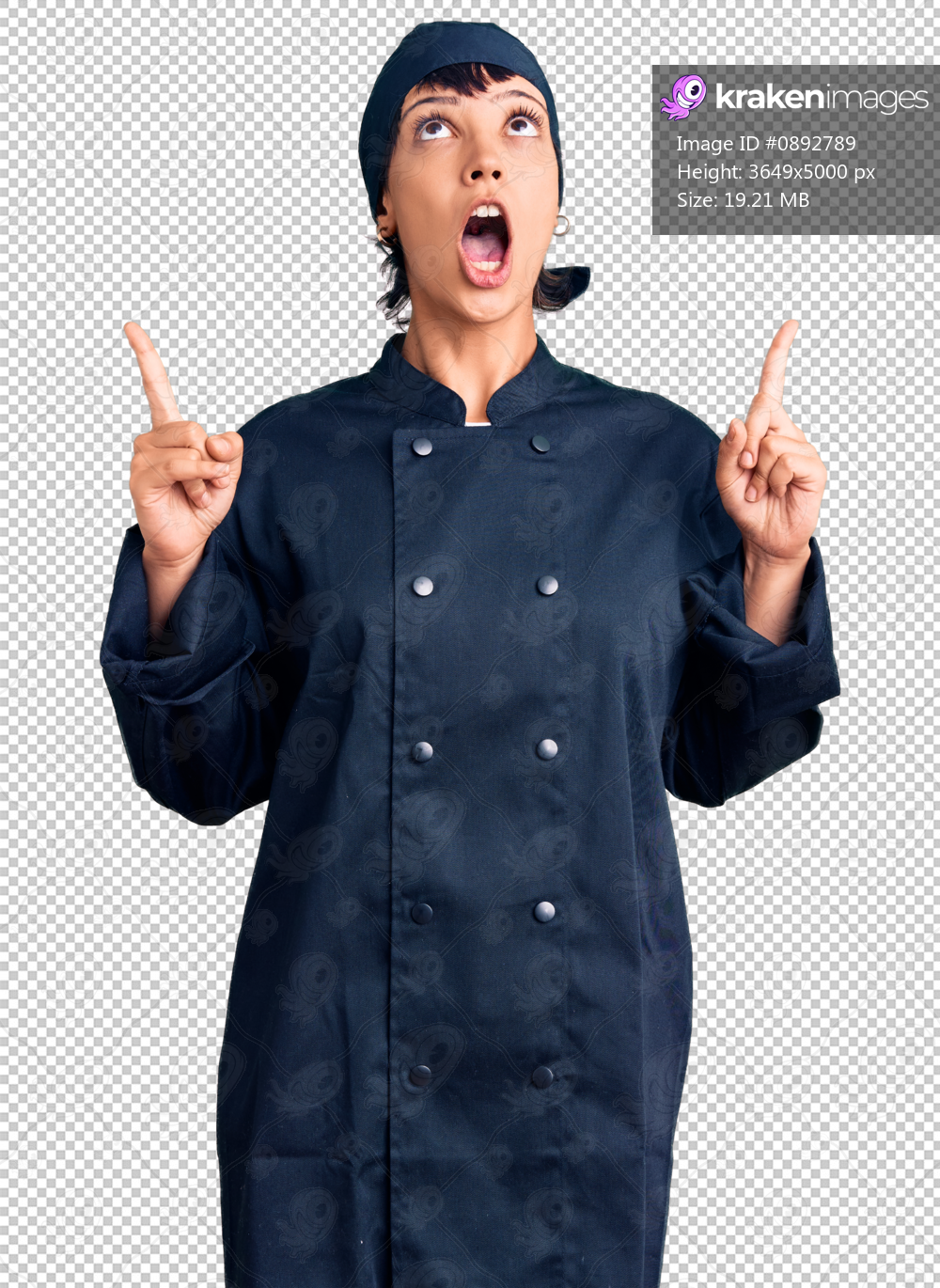Young brunette woman with short hair wearing professional cook uniform amazed and surprised looking up and pointing with fingers and raised arms.