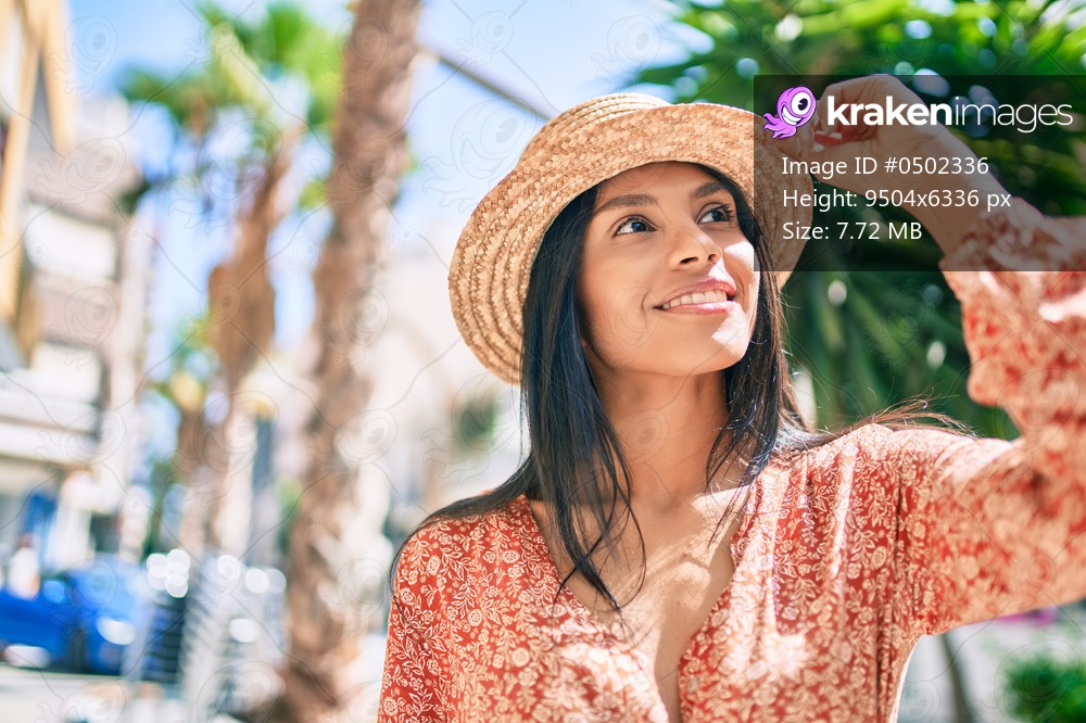 Young african american tourist woman on vacation smiling happy walking at the city.