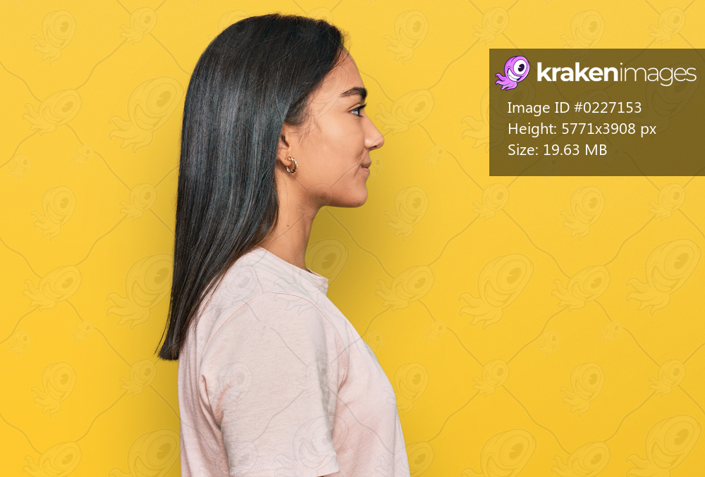 Young asian woman wearing casual clothes looking to side, relax profile pose with natural face with confident smile. 