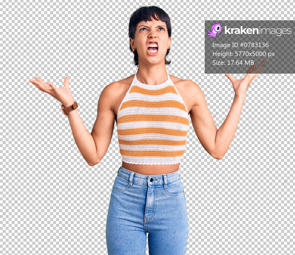 Young brunette woman with short hair wearing casual clothes crazy and mad shouting and yelling with aggressive expression and arms raised. frustration concept.