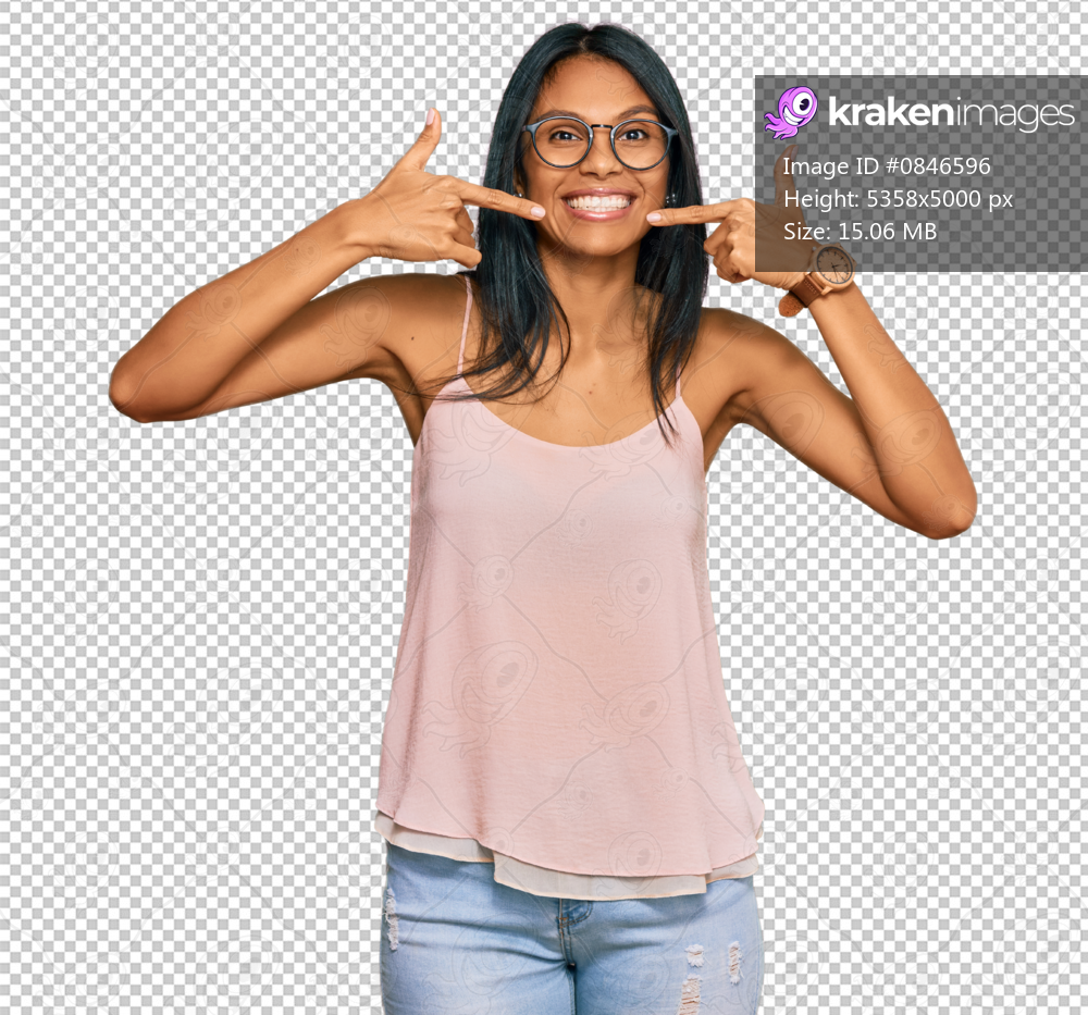 Young african american woman wearing casual clothes and glasses smiling cheerful showing and pointing with fingers teeth and mouth. dental health concept.