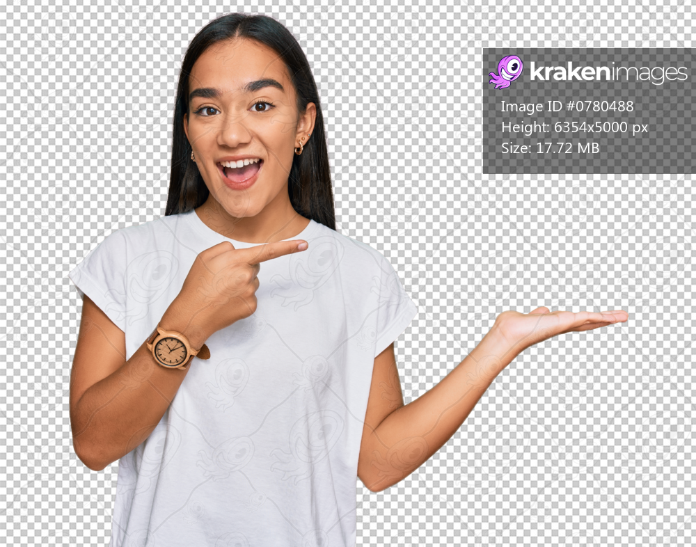 Young asian woman wearing casual white t shirt amazed and smiling to the camera while presenting with hand and pointing with finger.