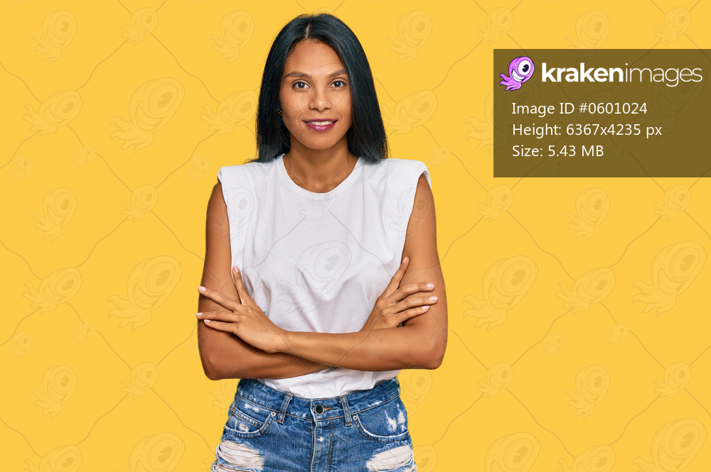 Young african american woman wearing casual clothes happy face smiling with crossed arms looking at the camera. positive person. 