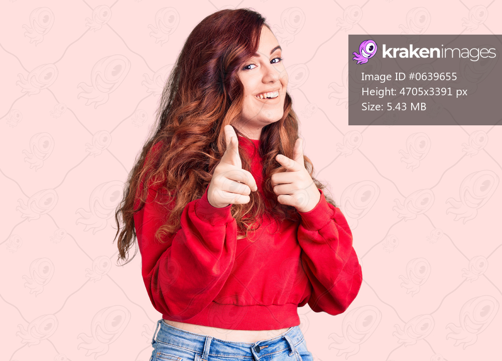 Young beautiful woman wearing casual winter sweater pointing fingers to camera with happy and funny face. good energy and vibes. 