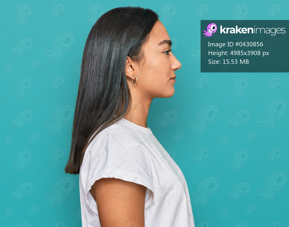 Young asian woman wearing casual white t shirt looking to side, relax profile pose with natural face with confident smile. 