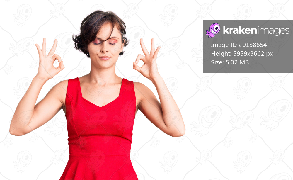 Beautiful young woman with short hair wearing casual style with sleeveless shirt relaxed and smiling with eyes closed doing meditation gesture with fingers. yoga concept. 