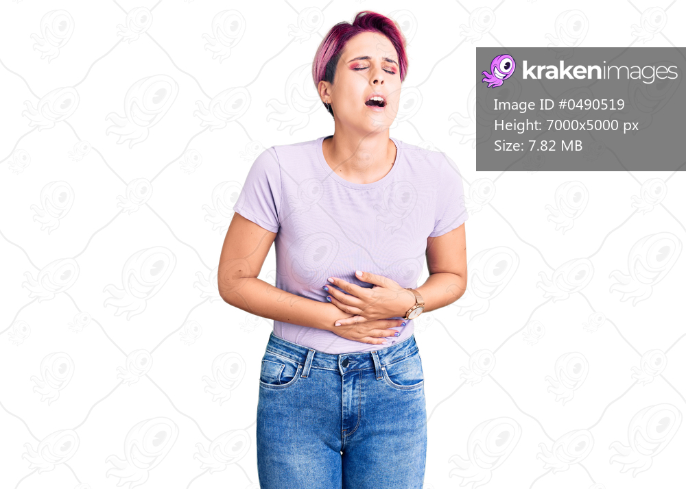 Young beautiful woman with pink hair wearing casual clothes with hand on stomach because nausea, painful disease feeling unwell. ache concept. 
