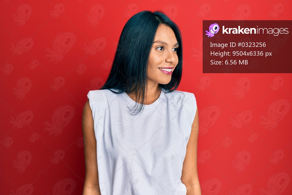 Young african american woman wearing casual clothes looking to side, relax profile pose with natural face and confident smile. 