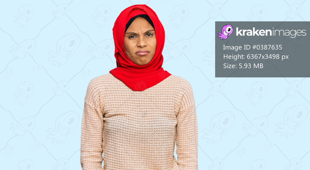 Young african american woman wearing traditional islamic hijab scarf depressed and worry for distress, crying angry and afraid. sad expression. 