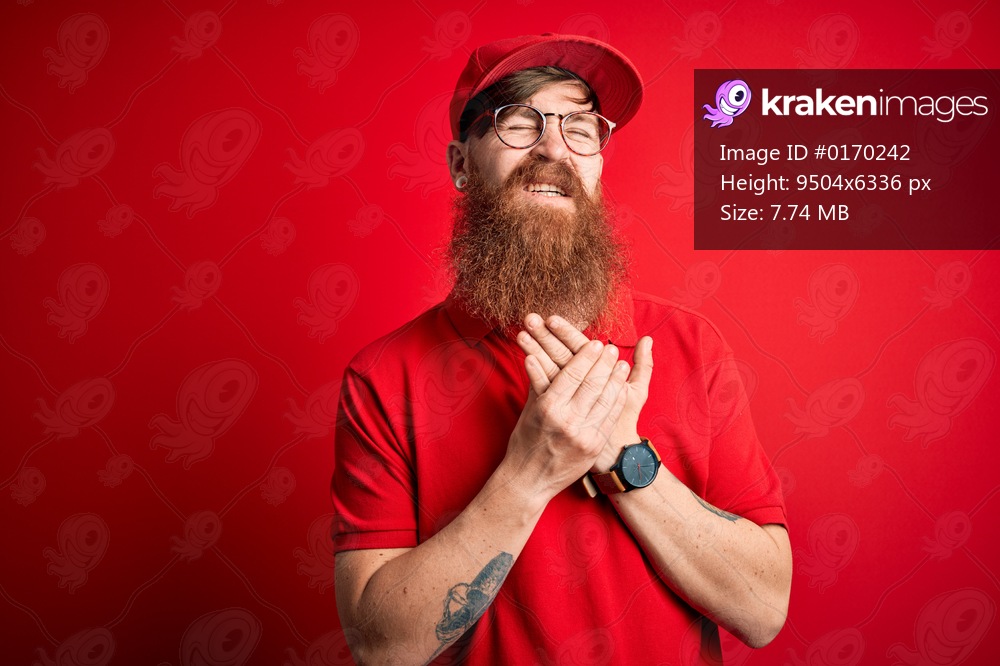 Young handsome delivery man wearing glasses and red cap over isolated background Suffering pain on hands and fingers, arthritis inflammation