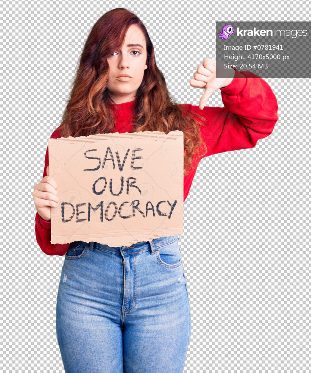 Young beautiful woman holding save our democracy protest banner with angry face, negative sign showing dislike with thumbs down, rejection concept