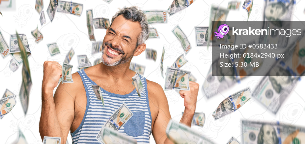 Middle age grey-haired man wearing casual style with sleeveless shirt very happy and excited doing winner gesture with arms raised, smiling and screaming for success. celebration concept.