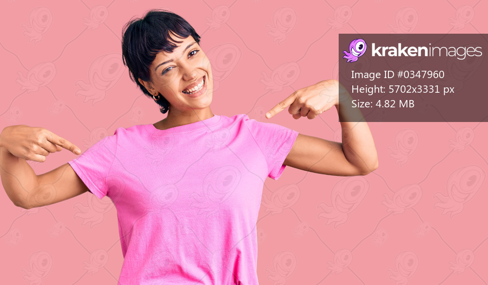 Young brunette woman with short hair wearing casual clothes looking confident with smile on face, pointing oneself with fingers proud and happy. 