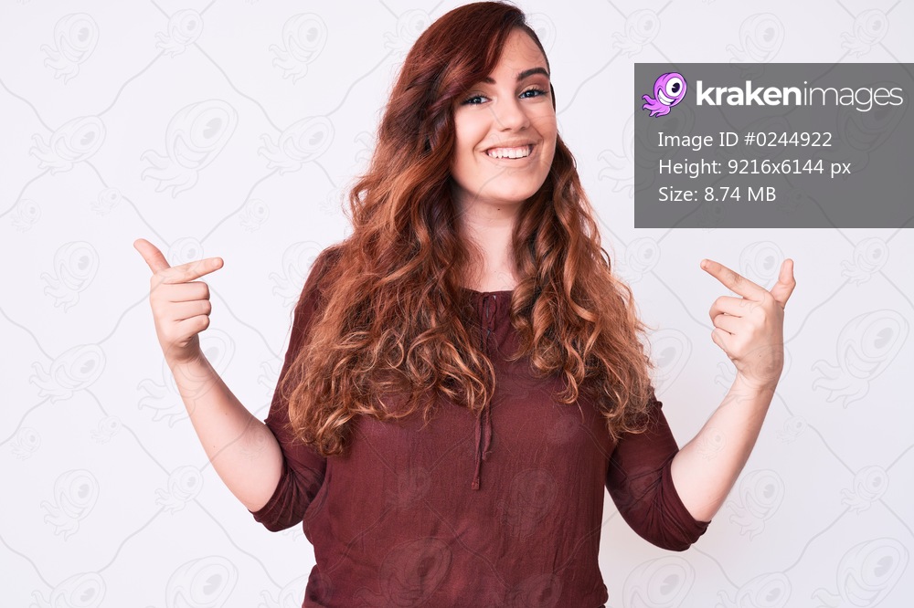 Young beautiful woman wearing casual clothes looking confident with smile on face, pointing oneself with fingers proud and happy. 
