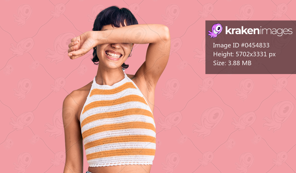 Young brunette woman with short hair wearing casual clothes covering eyes with arm smiling cheerful and funny. blind concept. 