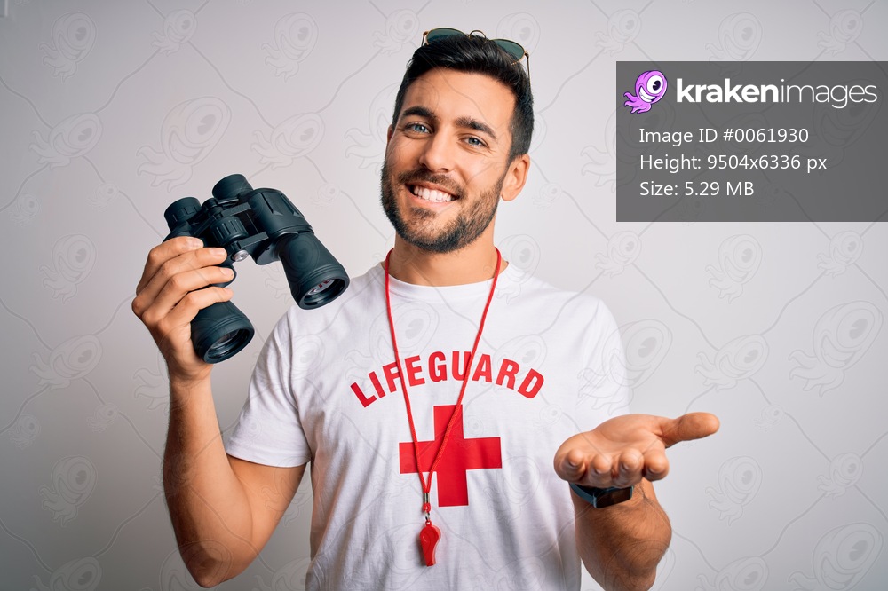 Young lifeguard man with beard wearing t-shirt with red cross and sunglasses using whistle smiling cheerful offering palm hand giving assistance and acceptance.