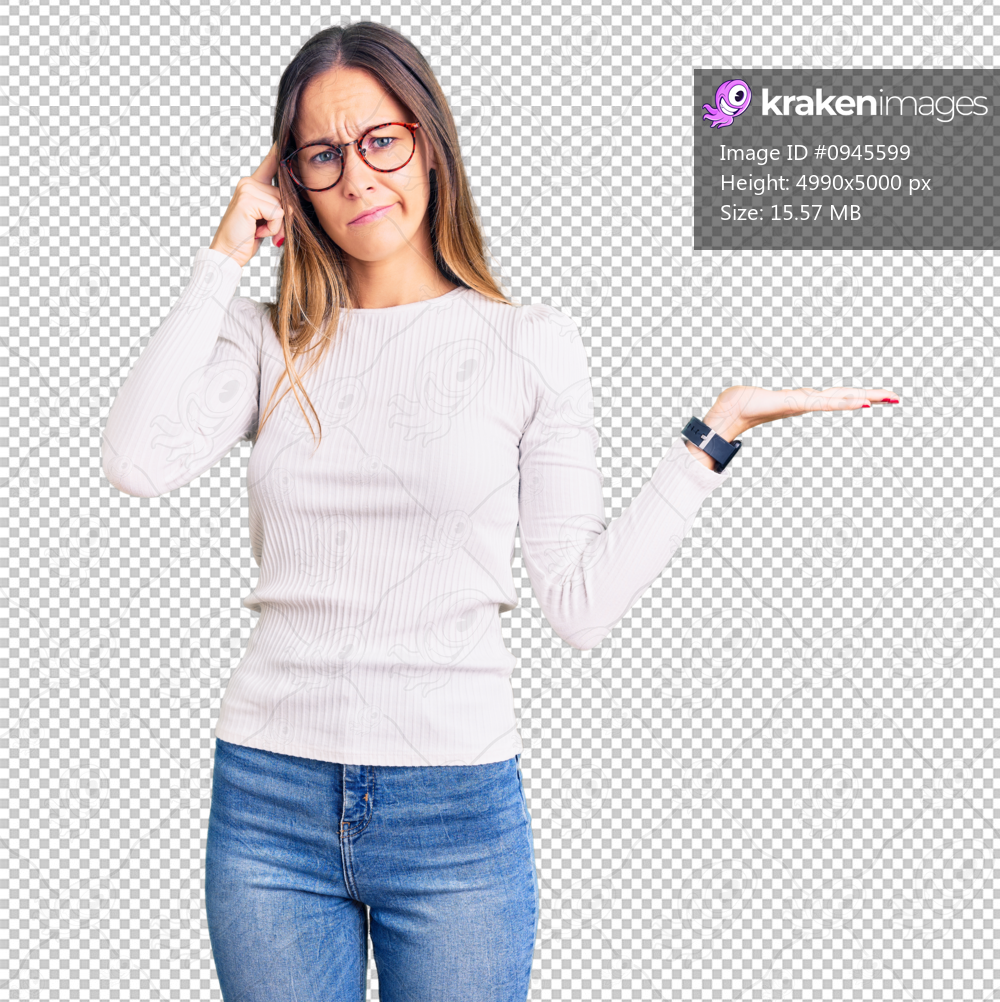 Beautiful brunette young woman wearing casual white sweater and glasses confused and annoyed with open palm showing copy space and pointing finger to forehead. think about it.