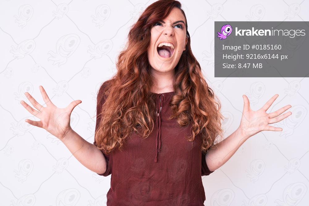 Young beautiful woman wearing casual clothes crazy and mad shouting and yelling with aggressive expression and arms raised. frustration concept. 