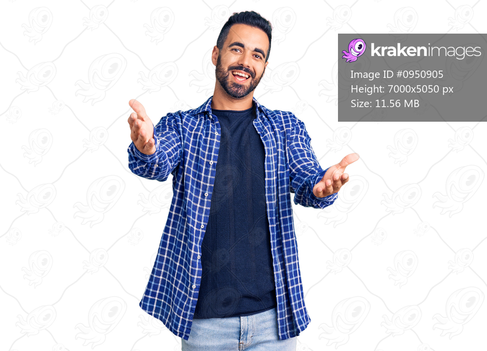 Young hispanic man wearing casual clothes smiling cheerful offering hands giving assistance and acceptance. 