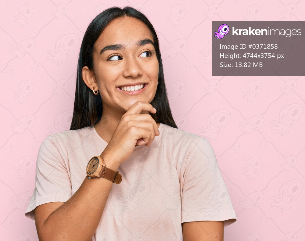 Young asian woman wearing casual clothes with hand on chin thinking about question, pensive expression. smiling with thoughtful face. doubt concept. 