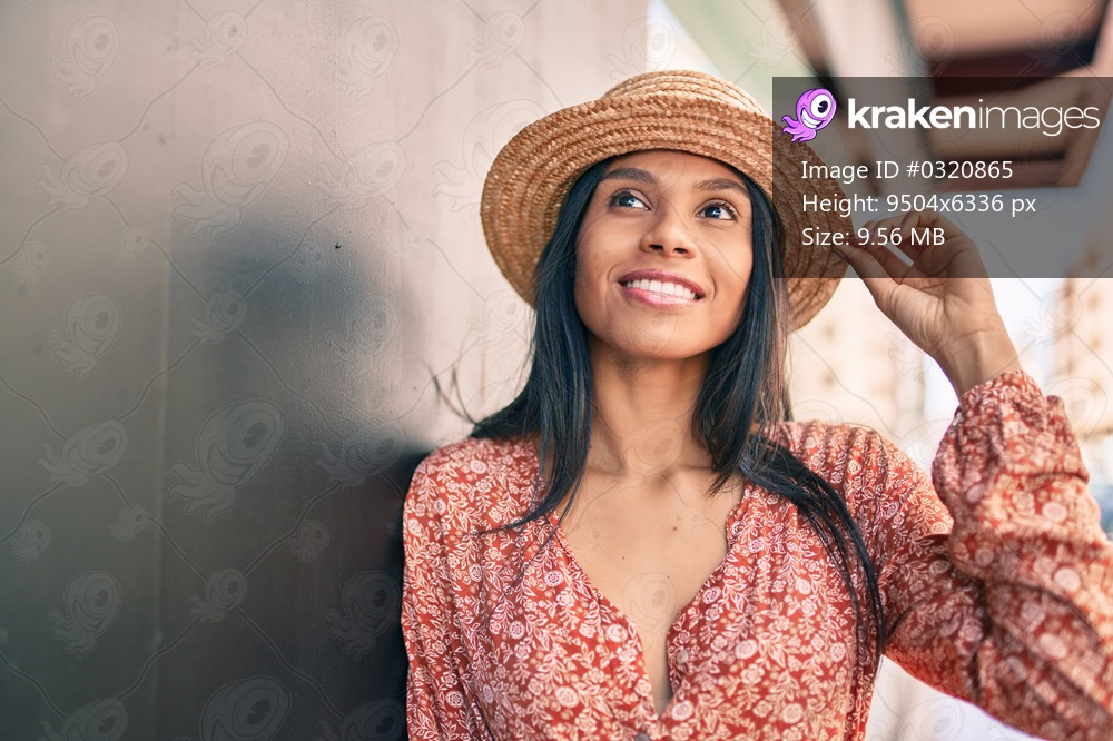 Young african american tourist woman on vacation smiling happy at the city.
