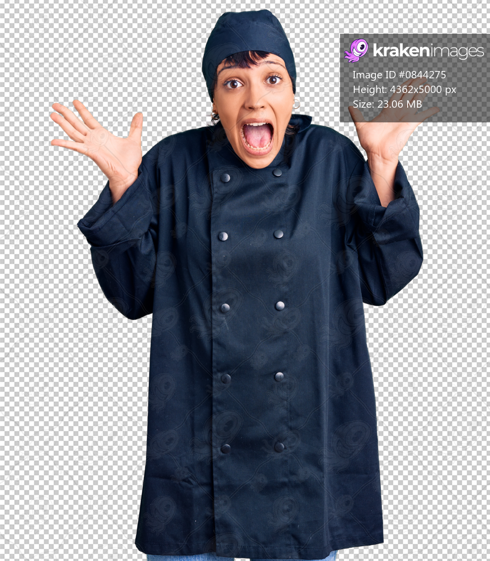 Young brunette woman with short hair wearing professional cook uniform celebrating crazy and amazed for success with arms raised and open eyes screaming excited. winner concept