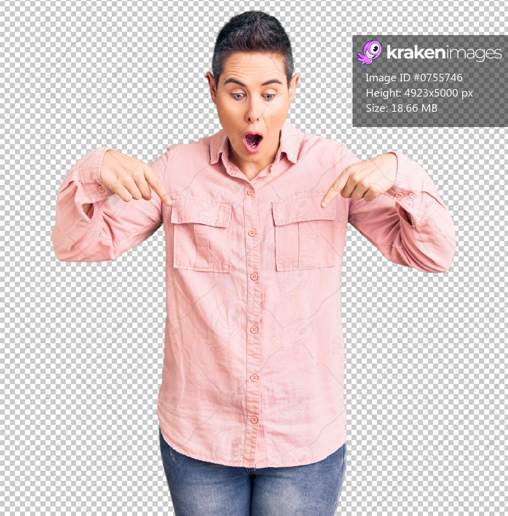 Young woman with short hair wearing casual clothes pointing down with fingers showing advertisement, surprised face and open mouth