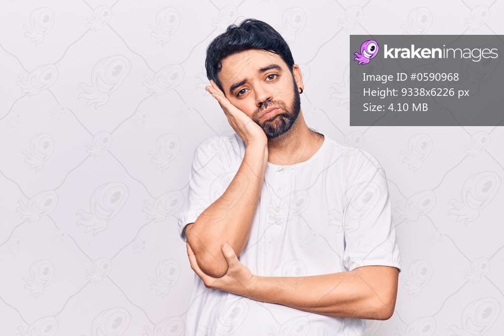 Young hispanic man wearing casual clothes thinking looking tired and bored with depression problems with crossed arms. 