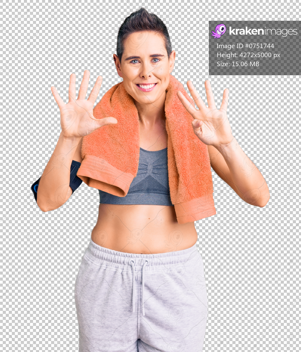 Young woman with short hair wearing sportswear and towel using smartphone showing and pointing up with fingers number nine while smiling confident and happy.