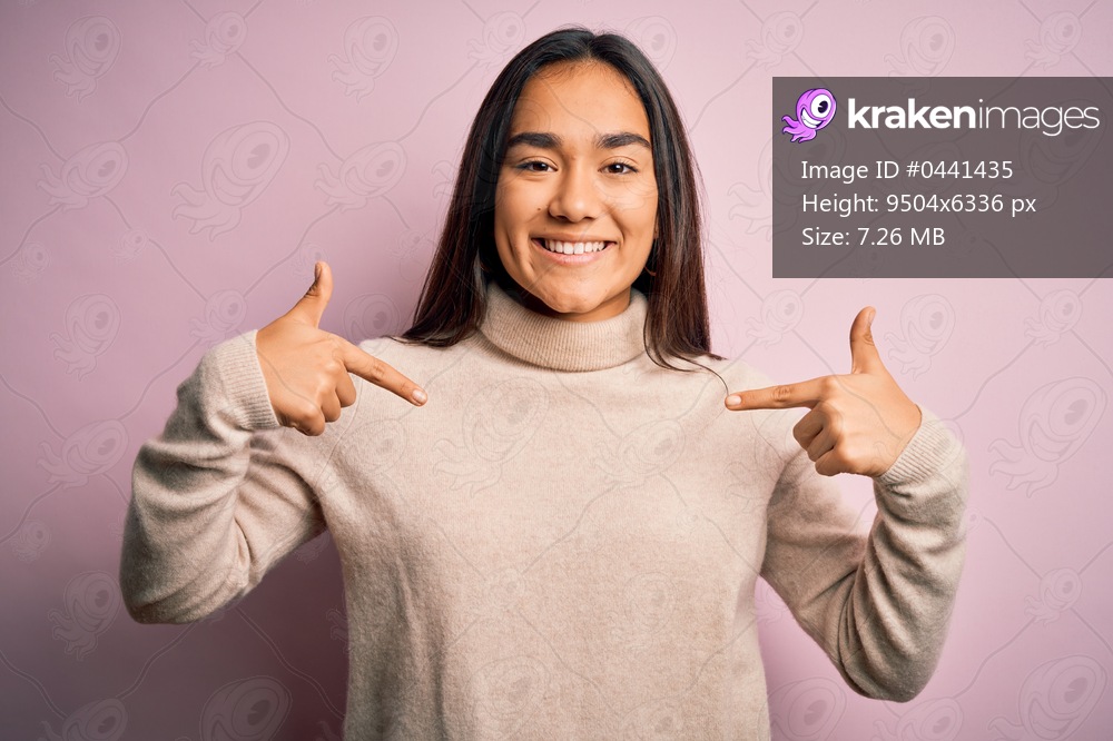 Young beautiful asian woman wearing casual turtleneck sweater over pink background looking confident with smile on face, pointing oneself with fingers proud and happy.