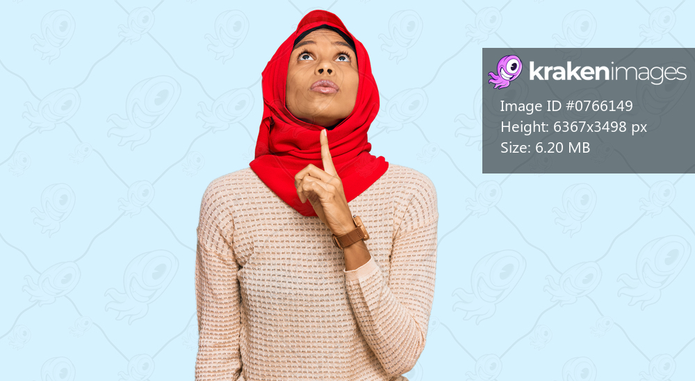 Young african american woman wearing traditional islamic hijab scarf thinking concentrated about doubt with finger on chin and looking up wondering 