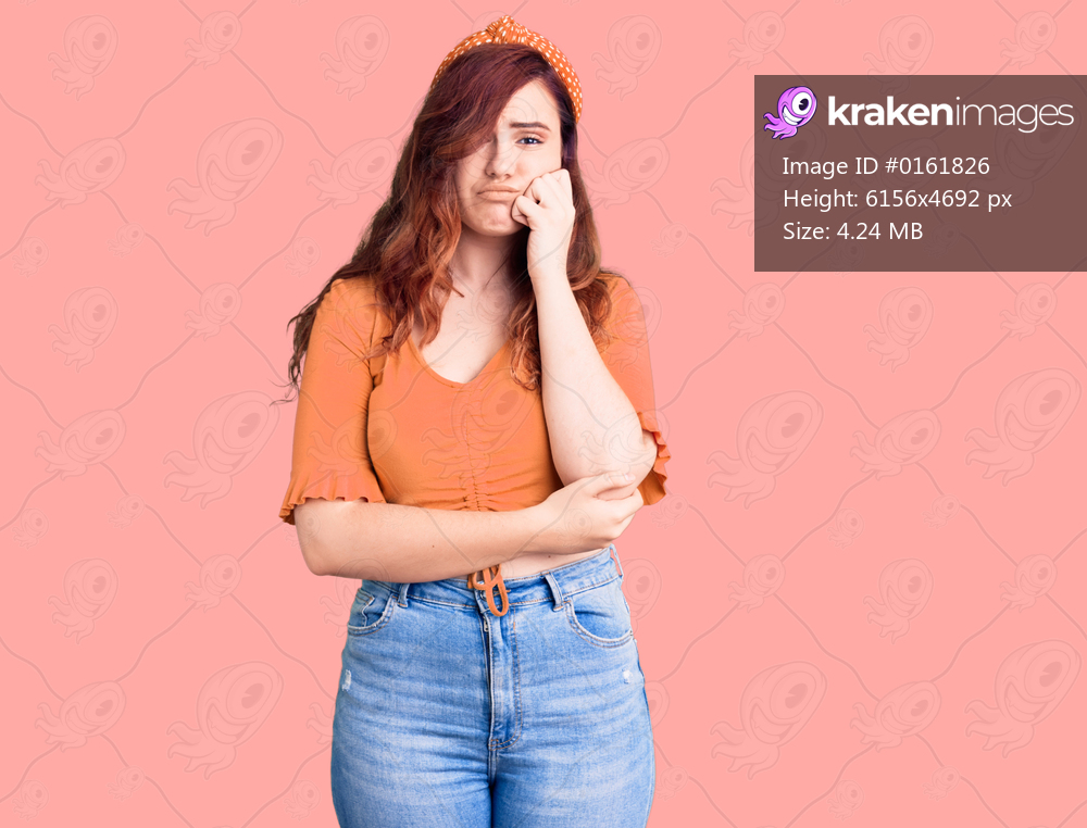 Young beautiful woman wearing casual clothes thinking looking tired and bored with depression problems with crossed arms. 