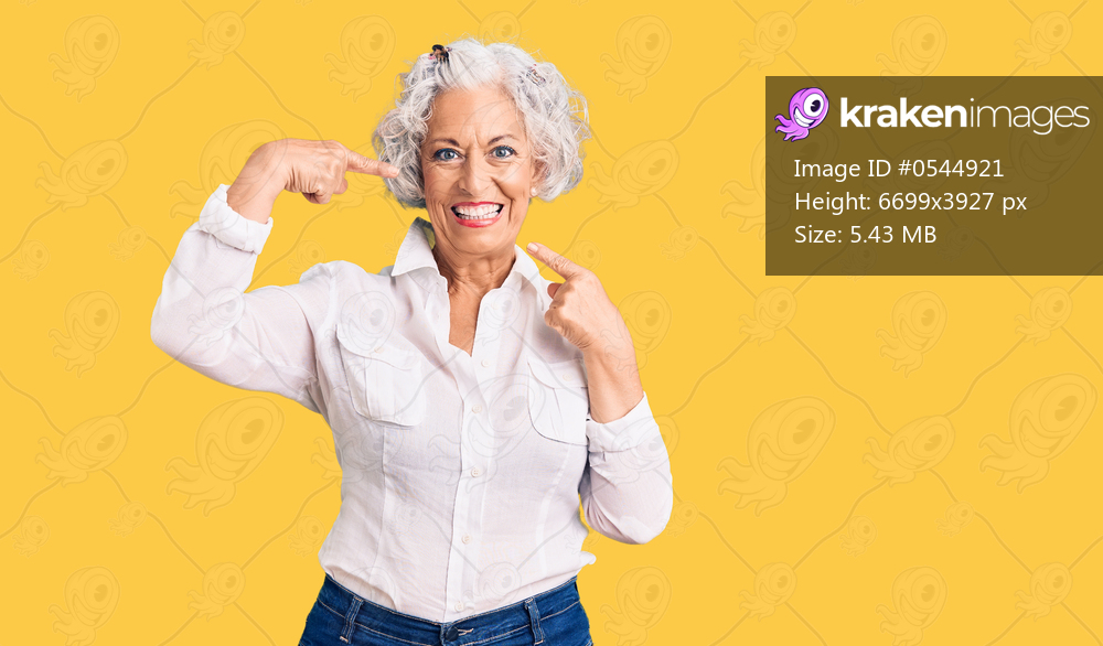 Senior grey-haired woman wearing casual clothes smiling cheerful showing and pointing with fingers teeth and mouth. dental health concept. 