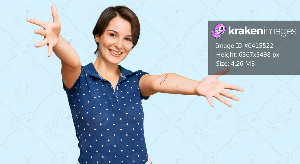 Young brunette woman with short hair wearing casual clothes looking at the camera smiling with open arms for hug. cheerful expression embracing happiness. 