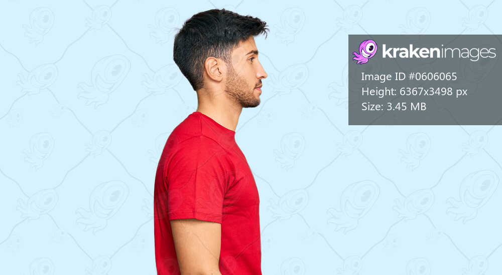 Young handsome man wearing casual red tshirt looking to side, relax profile pose with natural face and confident smile. 