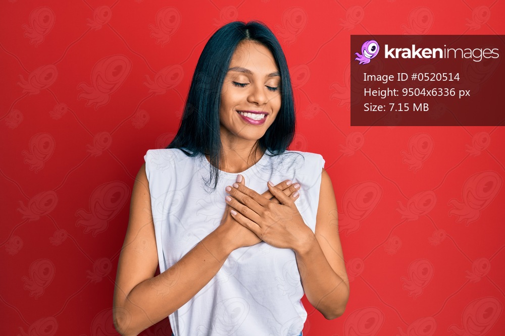 Young african american woman wearing casual clothes smiling with hands on chest, eyes closed with grateful gesture on face. health concept. 