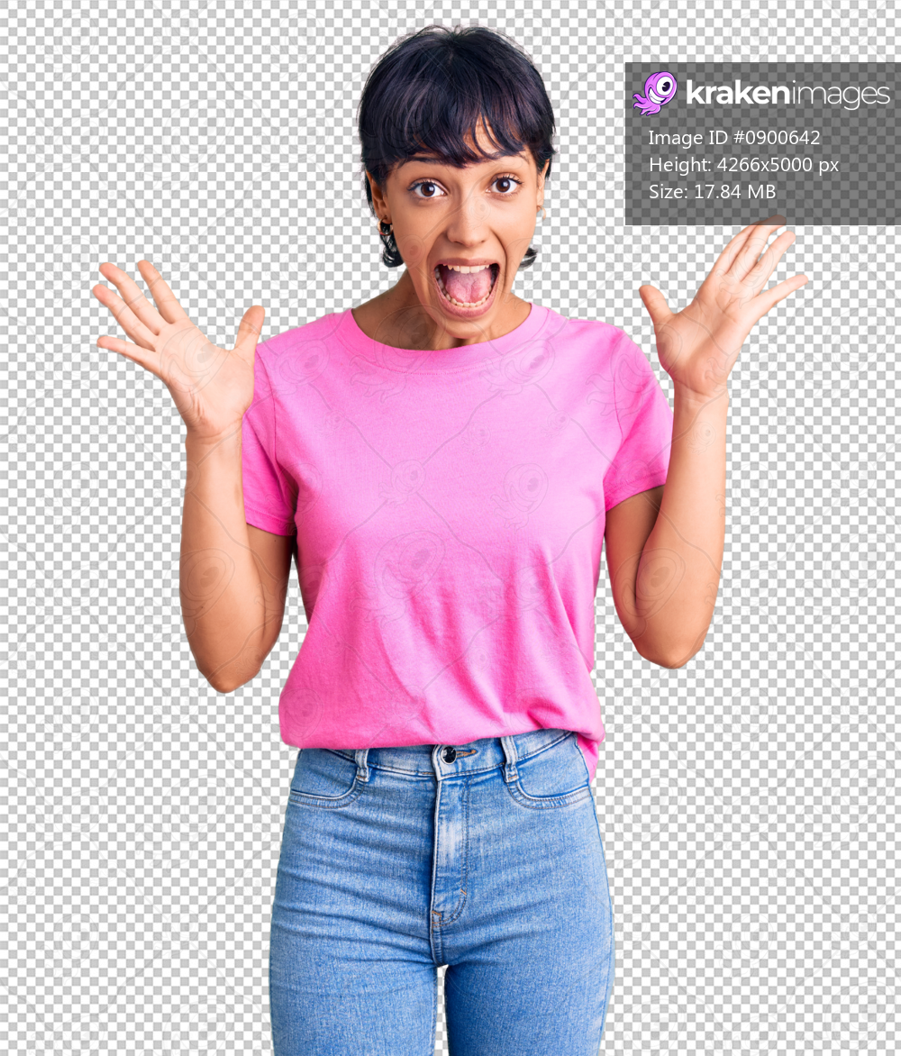 Young brunette woman with short hair wearing casual clothes celebrating crazy and amazed for success with arms raised and open eyes screaming excited. winner concept