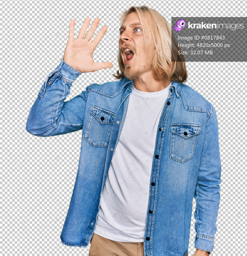 Caucasian man with blond long hair wearing casual denim jacket shouting and screaming loud to side with hand on mouth. communication concept.