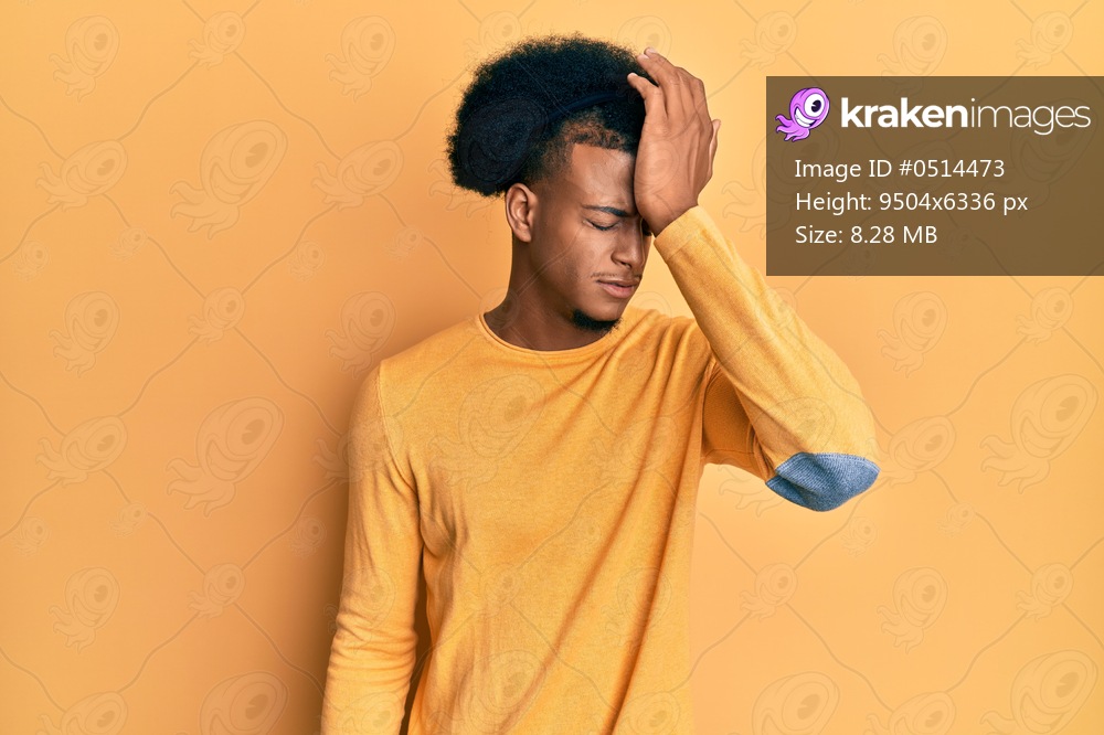 African american man with afro hair wearing casual clothes surprised with hand on head for mistake, remember error. forgot, bad memory concept. 