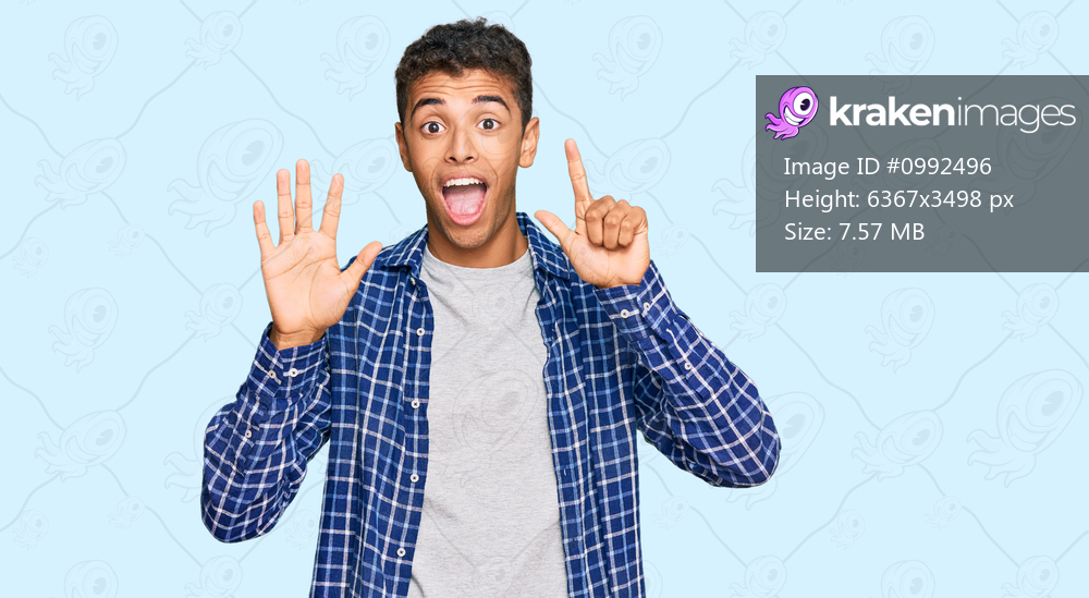 Young handsome african american man wearing casual clothes showing and pointing up with fingers number seven while smiling confident and happy. 