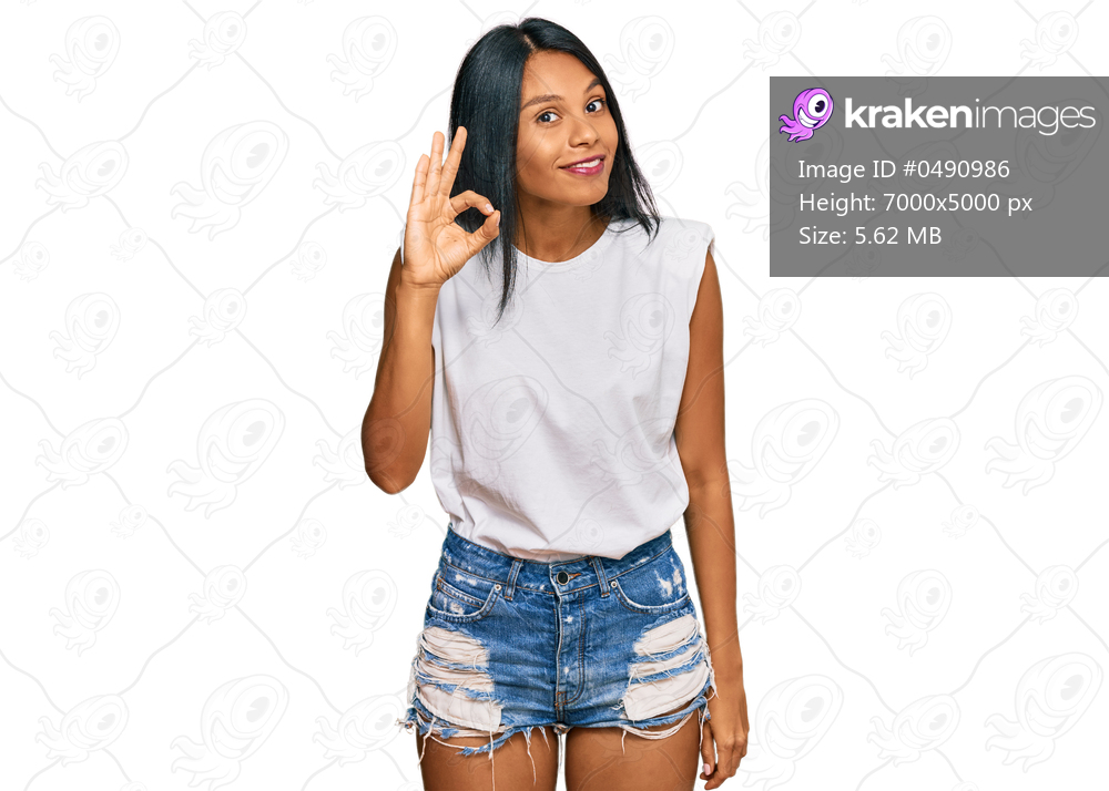 Young african american woman wearing casual clothes smiling positive doing ok sign with hand and fingers. successful expression. 