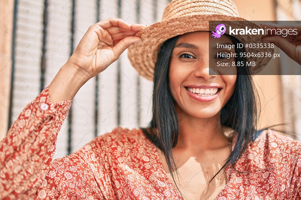 Young african american tourist woman on vacation smiling happy walking at the city.