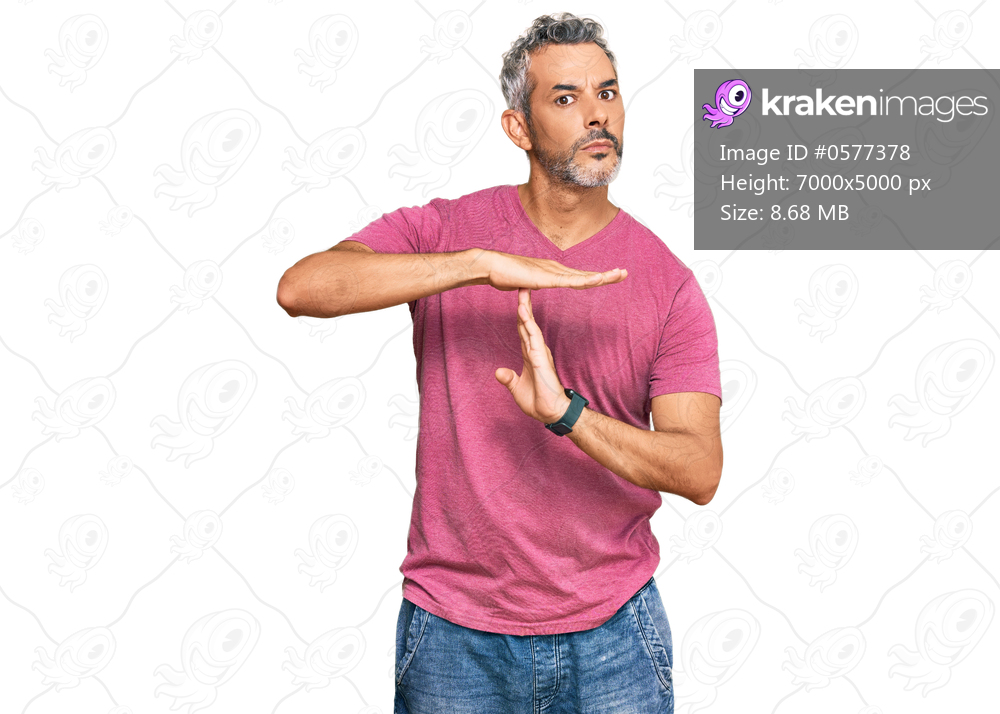 Middle age grey-haired man wearing casual clothes doing time out gesture with hands, frustrated and serious face 