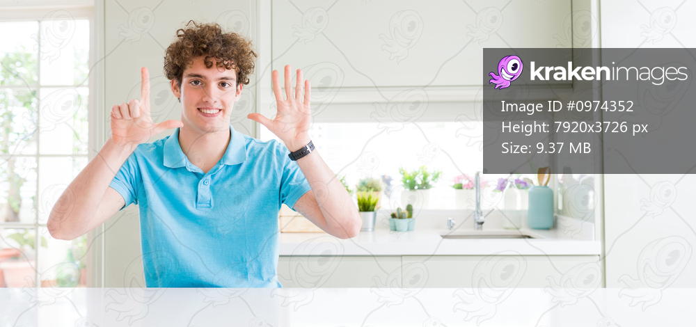 Wide shot of young handsome man at home showing and pointing up with fingers number seven while smiling confident and happy.