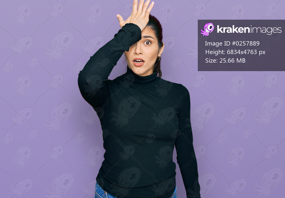 Young hispanic woman wearing casual clothes surprised with hand on head for mistake, remember error. forgot, bad memory concept. 