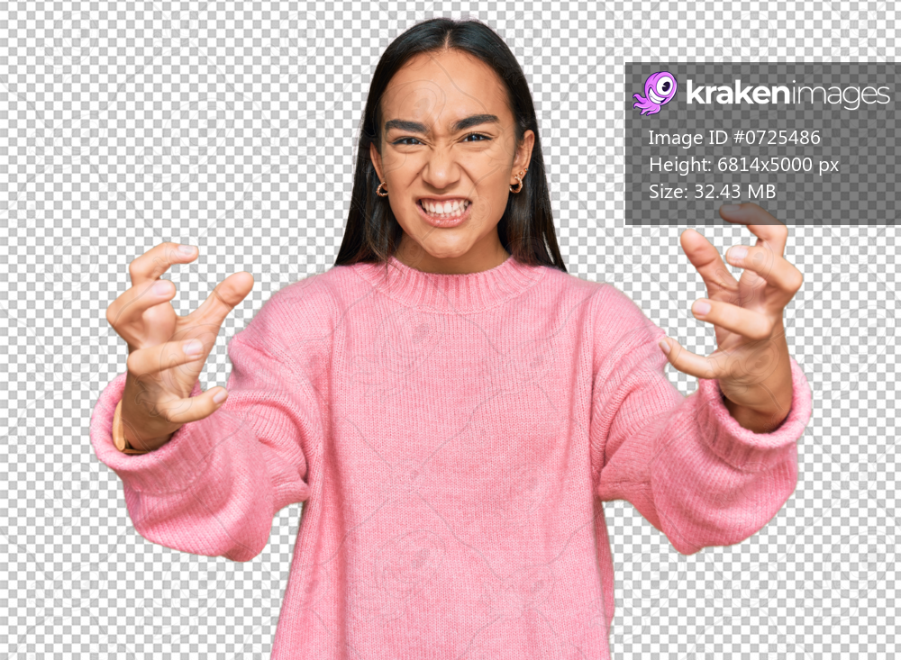 Young asian woman wearing casual winter sweater shouting frustrated with rage, hands trying to strangle, yelling mad