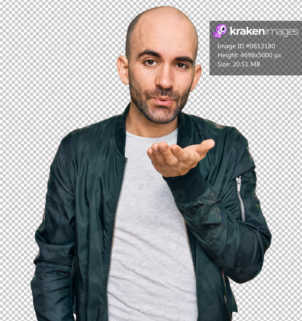 Young hispanic man wearing casual clothes looking at the camera blowing a kiss with hand on air being lovely and sexy. love expression.