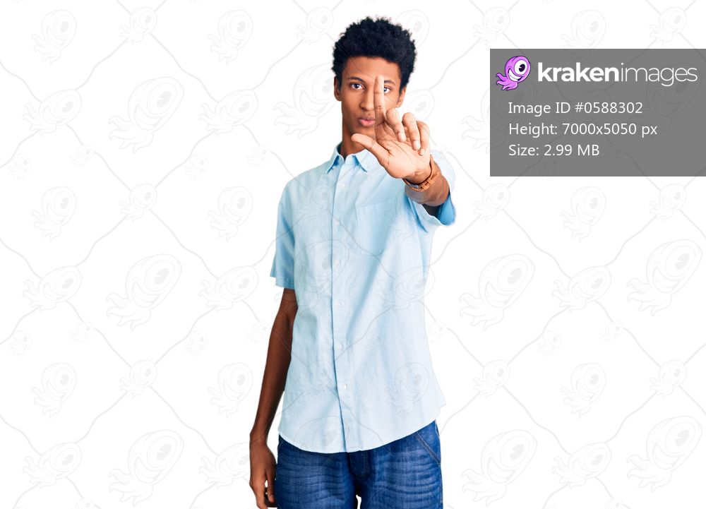Young african american man wearing casual clothes pointing with finger up and angry expression, showing no gesture 