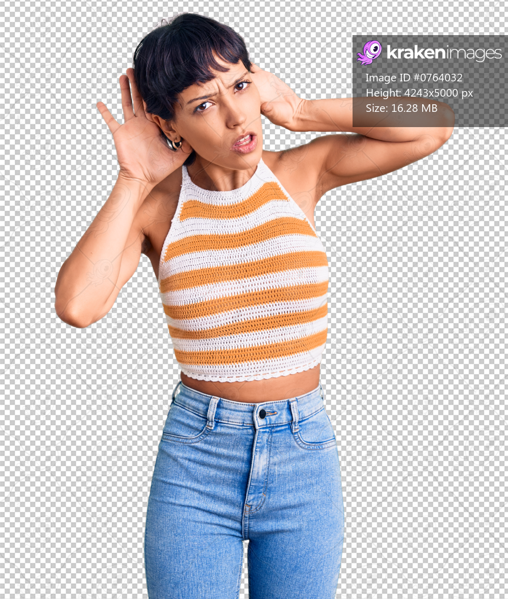 Young brunette woman with short hair wearing casual clothes trying to hear both hands on ear gesture, curious for gossip. hearing problem, deaf