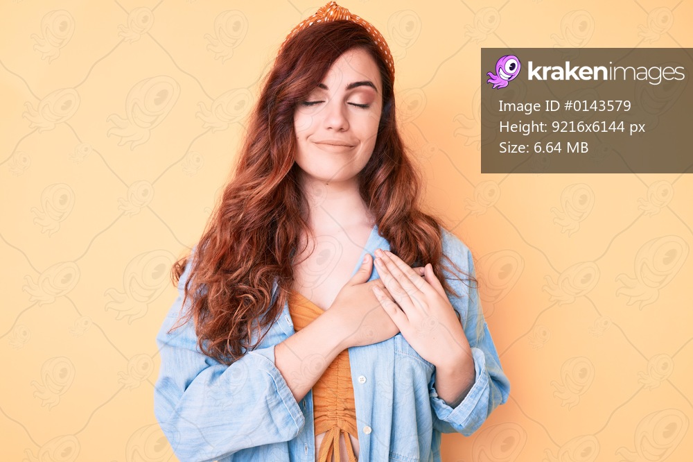 Young beautiful woman wearing casual clothes smiling with hands on chest, eyes closed with grateful gesture on face. health concept. 